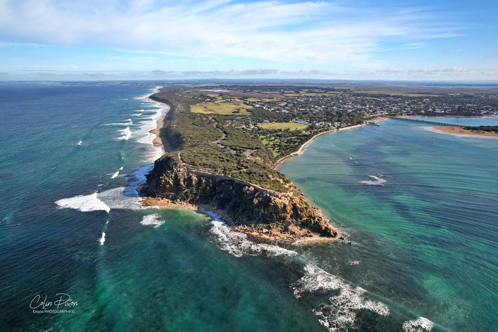 Aerial panorama of Barwon Heads Bridge, Barwon River and farmland, 28 May 2022